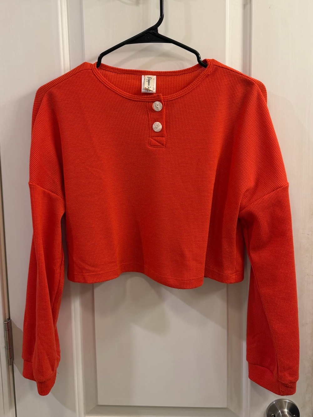 Dippin Daisy’s red long sleeve crop top